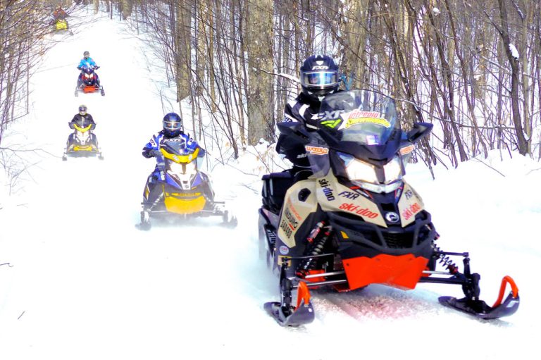SUPERTRAX TEAM WITH THE INTREPID SNOWMOBILER SUPERTRAX TEAM WITH THE INTREPID SNOWMOBILER